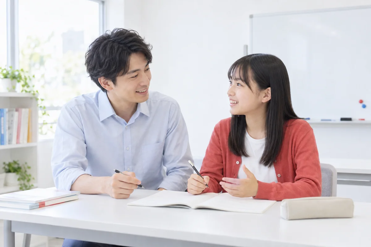 解き方を話し合う生徒と講師のイメージ